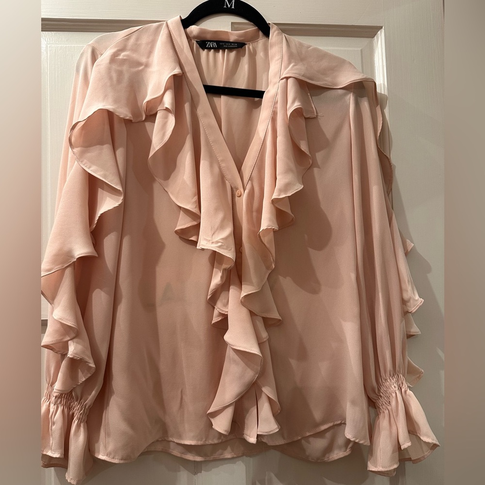 NWOT ZARA blush beautiful blouse with ruffle details. Elastic cuff sleeves.